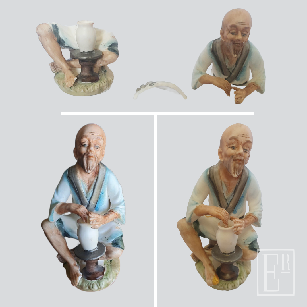 Seated potter figurine, broken then rejoined in gold